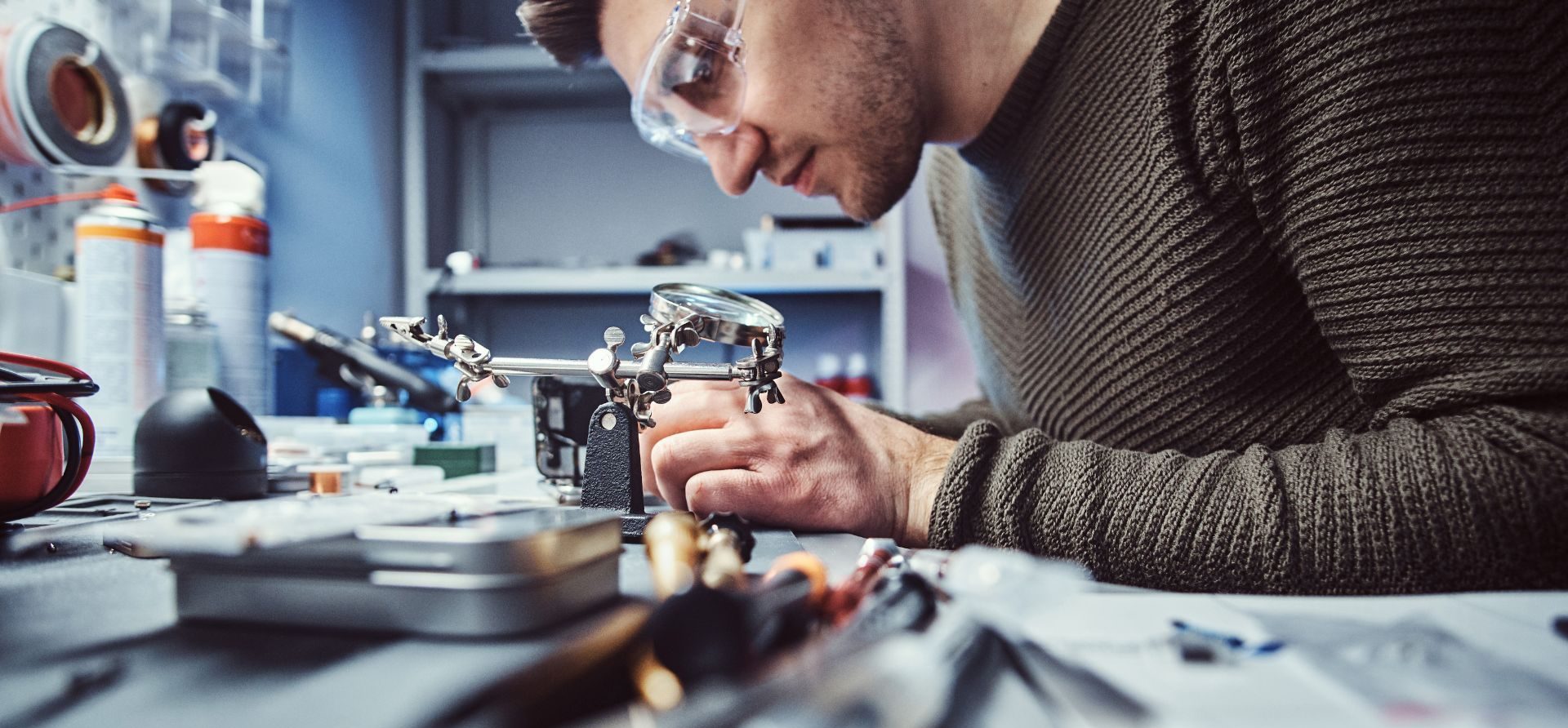 a male engineer working on a machine to create a product