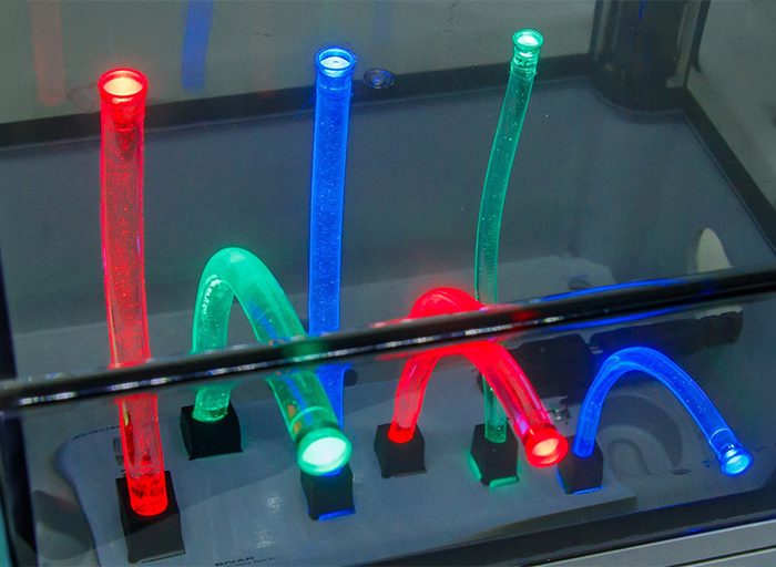 demo kit of UHF silicone flexible light pipes in red, green, and blue light as a showcase